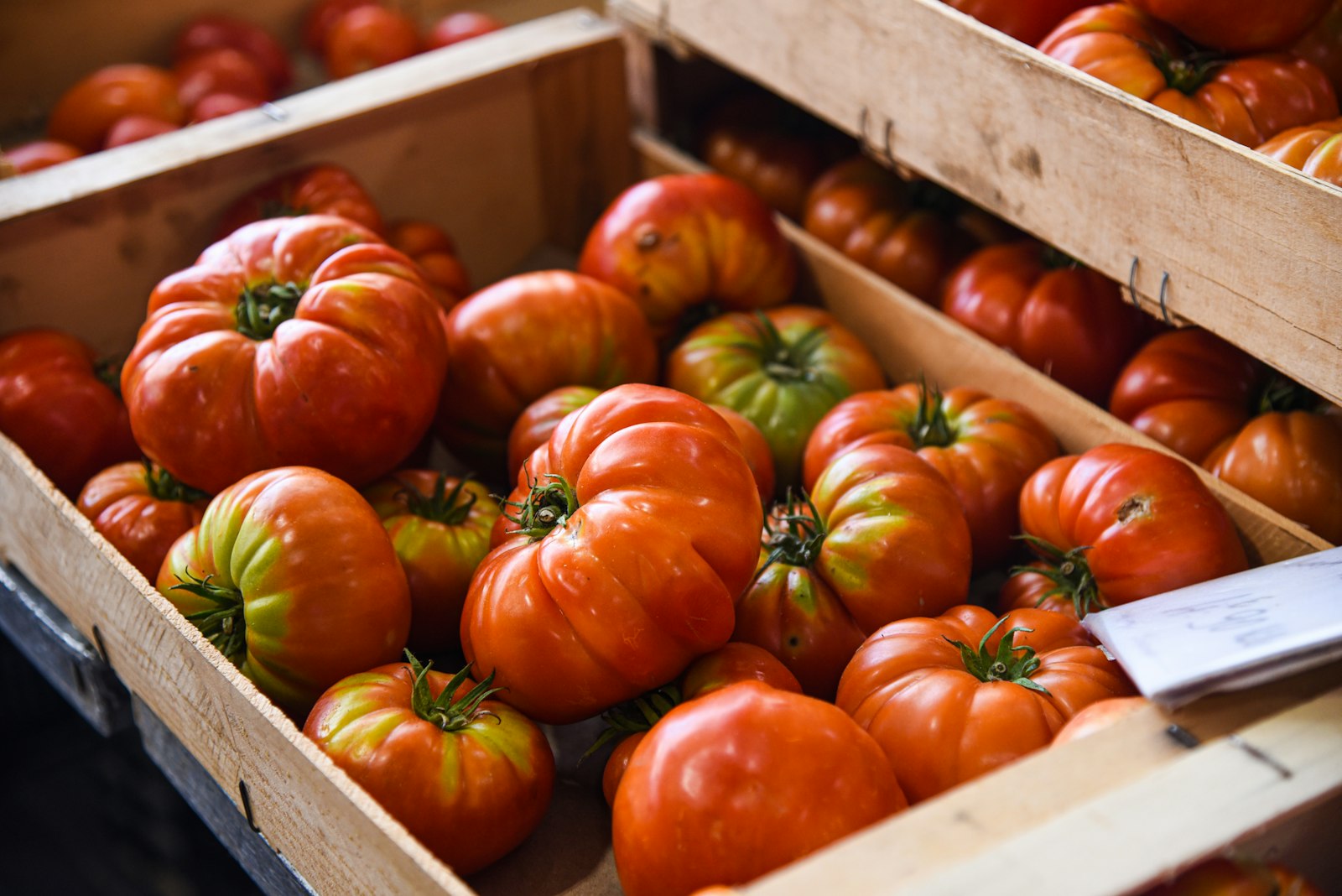 Heirloom tomatoes in wooden crates