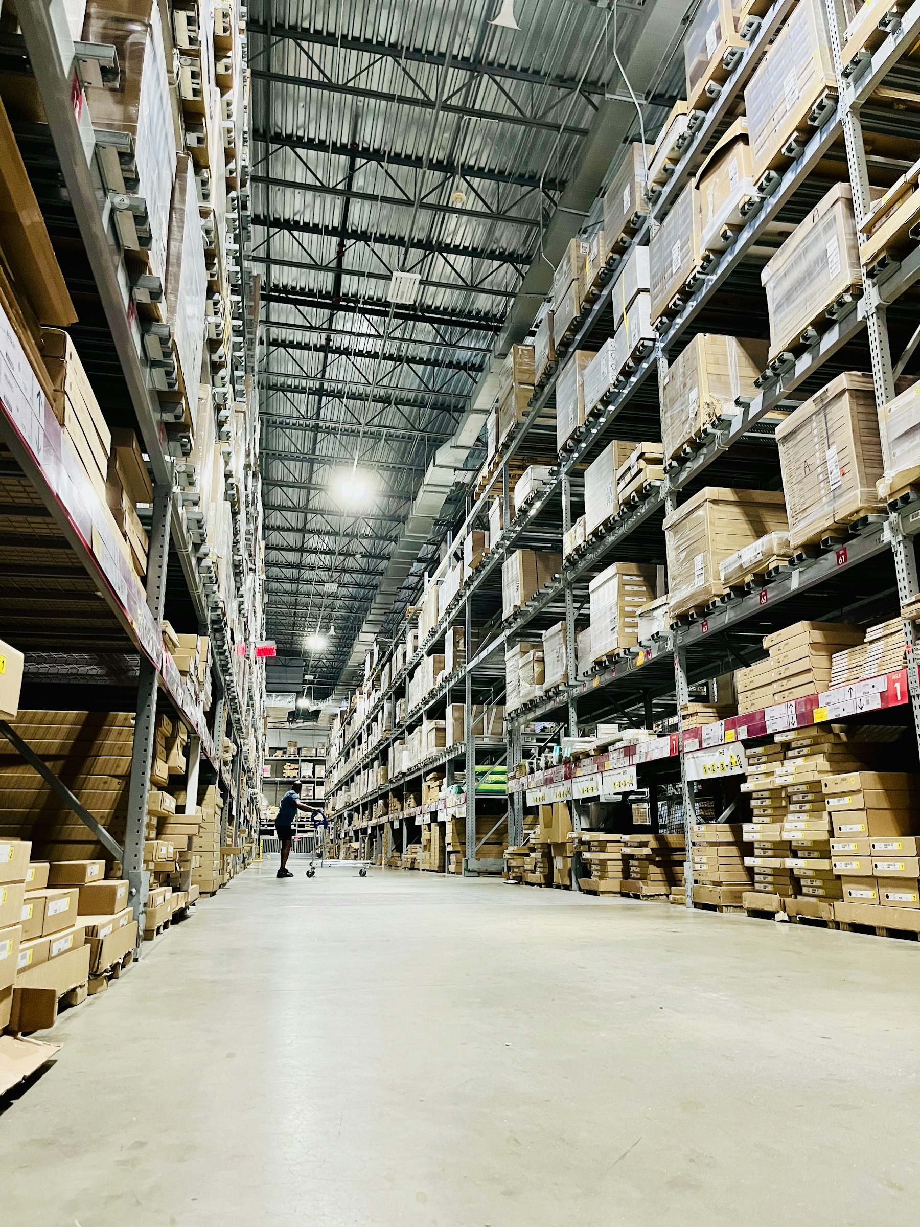 Tall warehouse racking stacked with cases